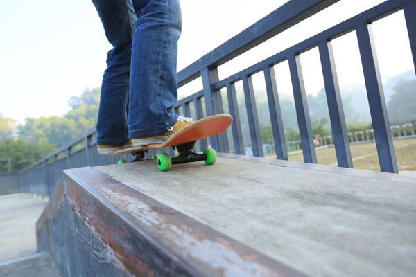 Skateboarder legs riding skateboard — Stock Photo, Image