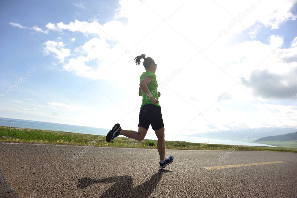 young woman running on city