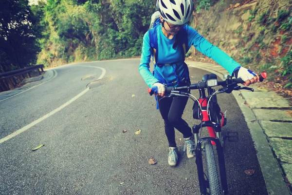 young woman riding mountain bike