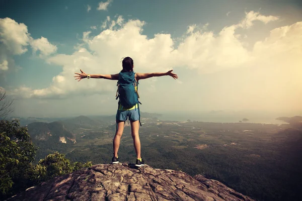 Young woman with raised hands — Stock Photo, Image