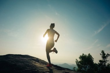 woman running at mountain topb