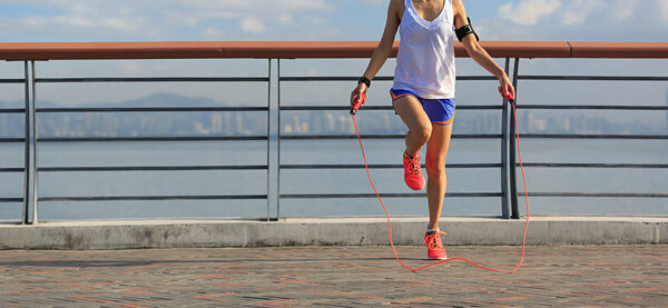 young woman jumping rope