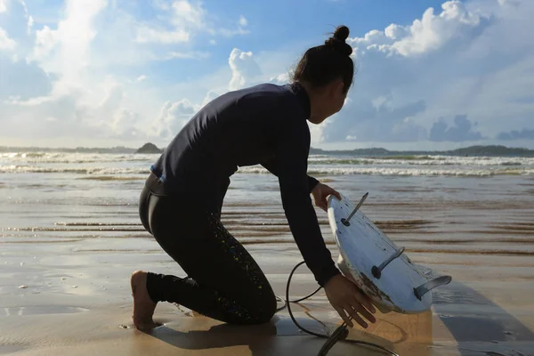 young woman ready to surf