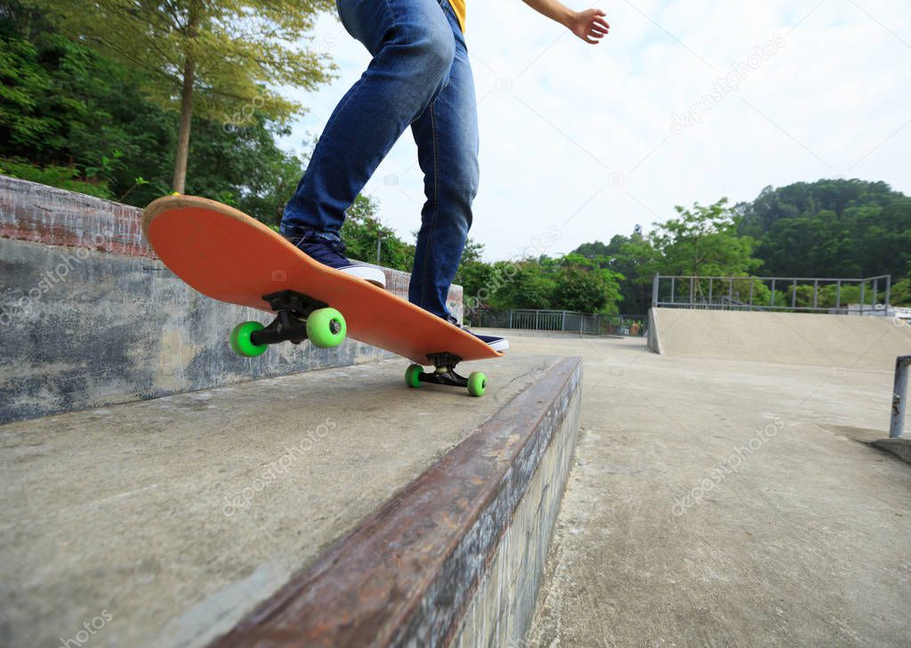 skateboarder legs riding skateboard