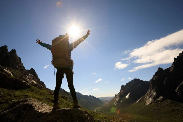 Young woman hiking in mountains Stock Image
