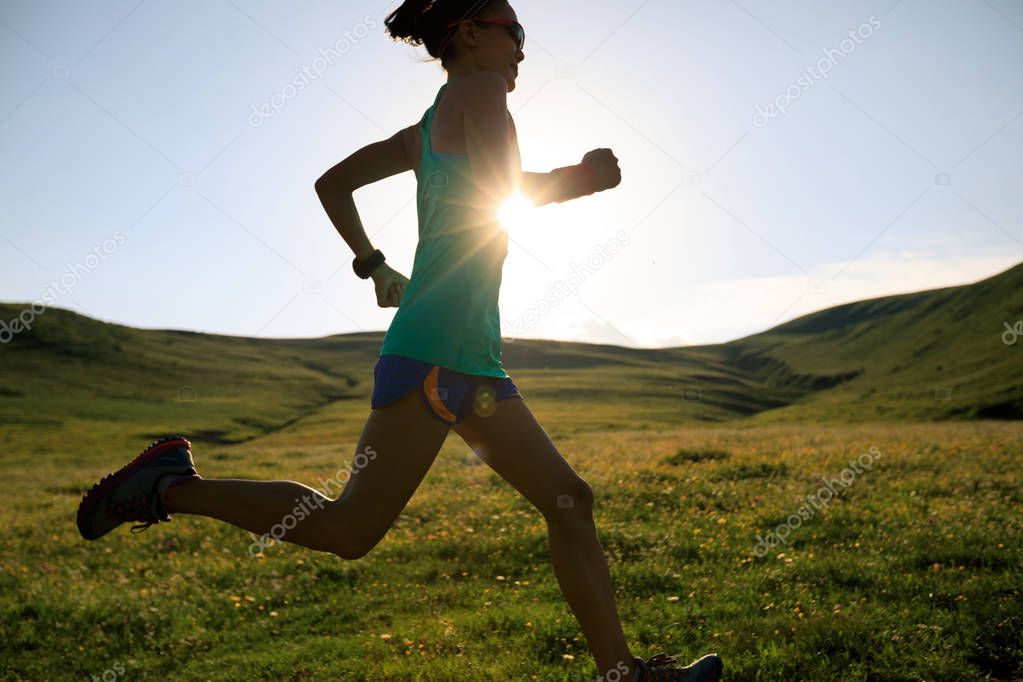 young woman running on meadow