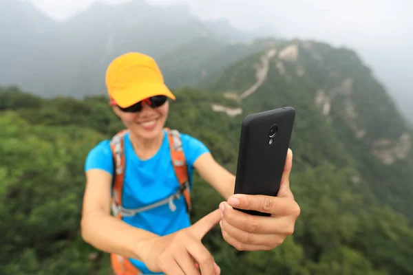 Woman taking photo with smartphone — Stock Photo, Image