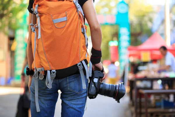 tourist with camera on the street at ancient xian street, china