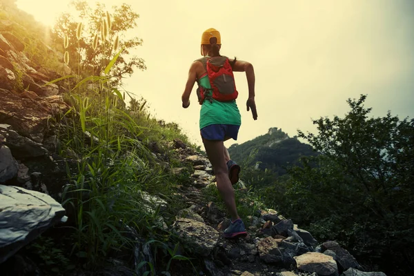 young woman running at great wall