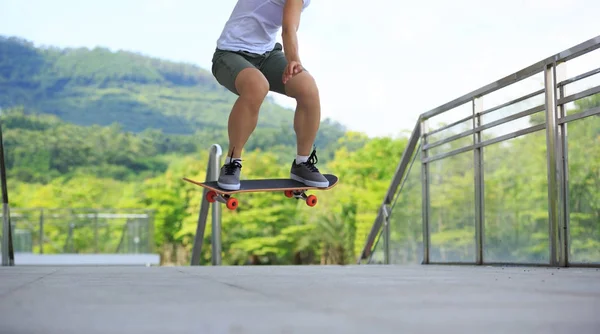Skateboarder legs at city — Stock Photo, Image
