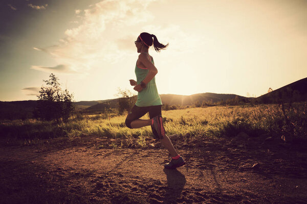 woman running on forest trail