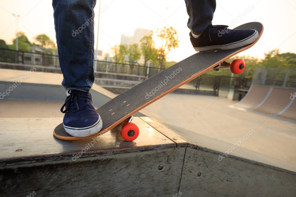 skateboarder practicing on ramp  