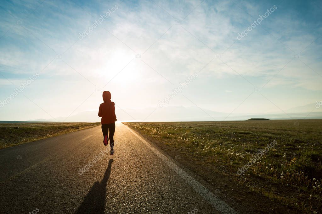 Young woman runner running