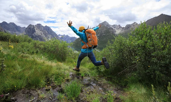 Young Backpacking Woman Jumping Water Mountains — Stock Photo, Image