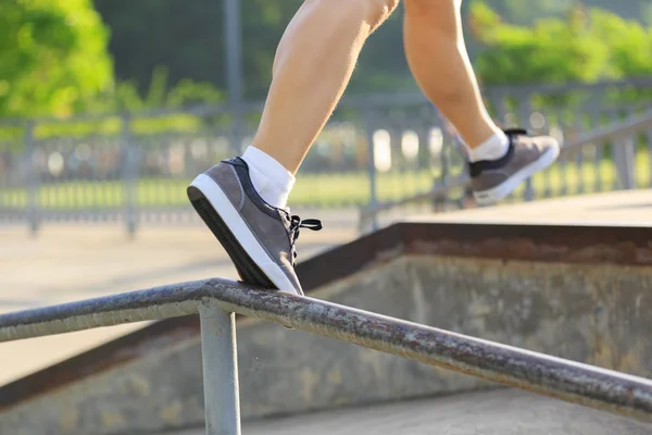 legs walking on steel pipe with balance