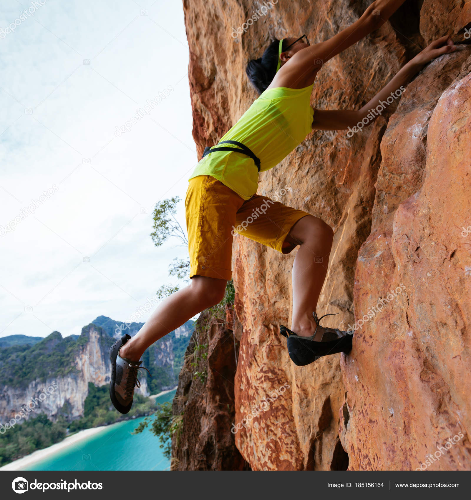 Female Rock Climber Climbing Seaside Cliff Stock Photo by ©lzf 185156164