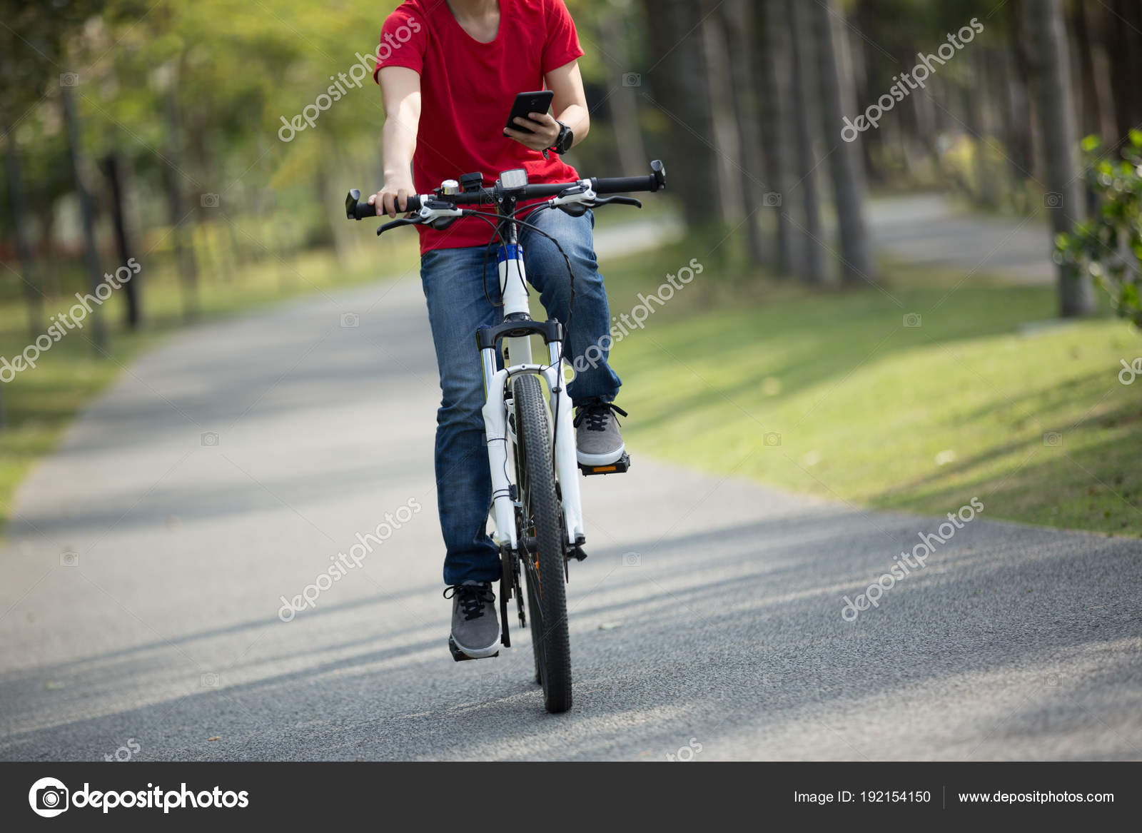 Cyclist Using Cellphone While Riding Bike Tropical Park — Stock - Main Image