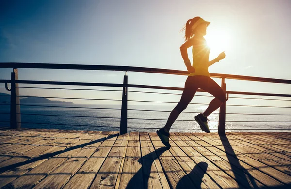 Sporty Female Runner Running Seaside Boardwalk Sunrise — Stock Photo, Image