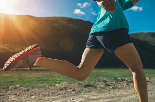 Spoorty young woman running on trail