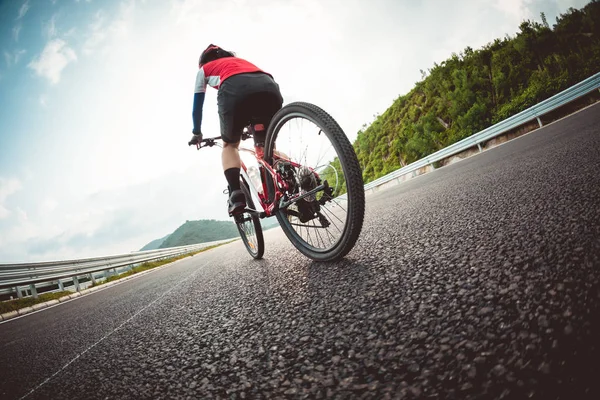 Female Cyclist Riding Bike Highway Sunset — Stock Photo, Image