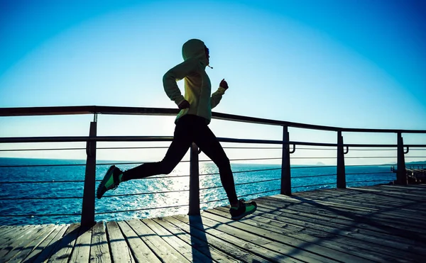 Sporty Female Jogger Exercising Seaside Boardwalk Morning Sunrise — Stockfoto