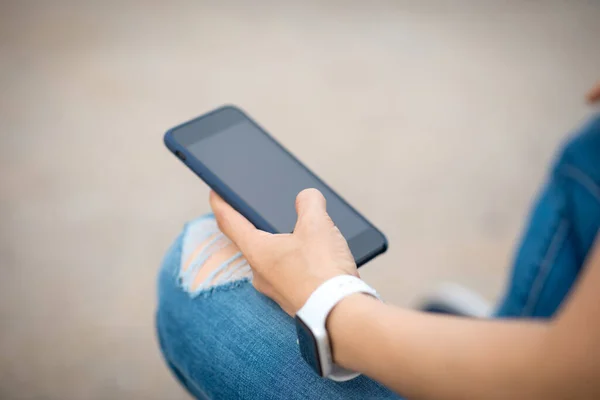 People hands  using smartphone outdoors