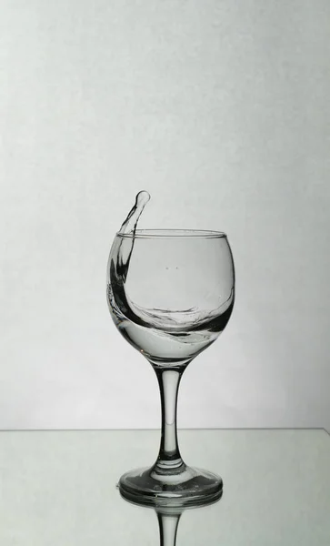 Splash of water in a wine glass — Stock Photo, Image