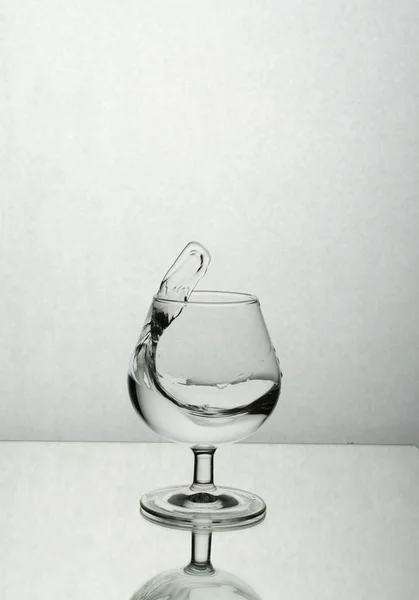 Splash of water in a wine glass — Stock Photo, Image