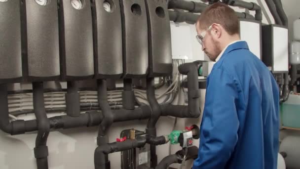 Young engineer checking new equipment — Stock Footage Young engineer checking new equipment Stock Footage