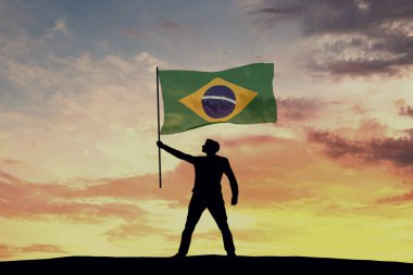 Brezilya bayrağı sallayan erkek silueti figürü. 3d Hazırlama