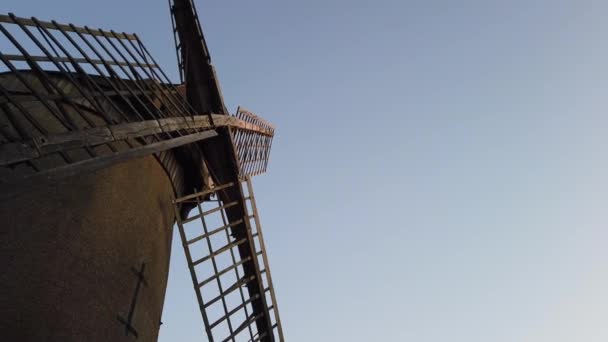 Camera pans across a old dutch style windmill — Stock Video