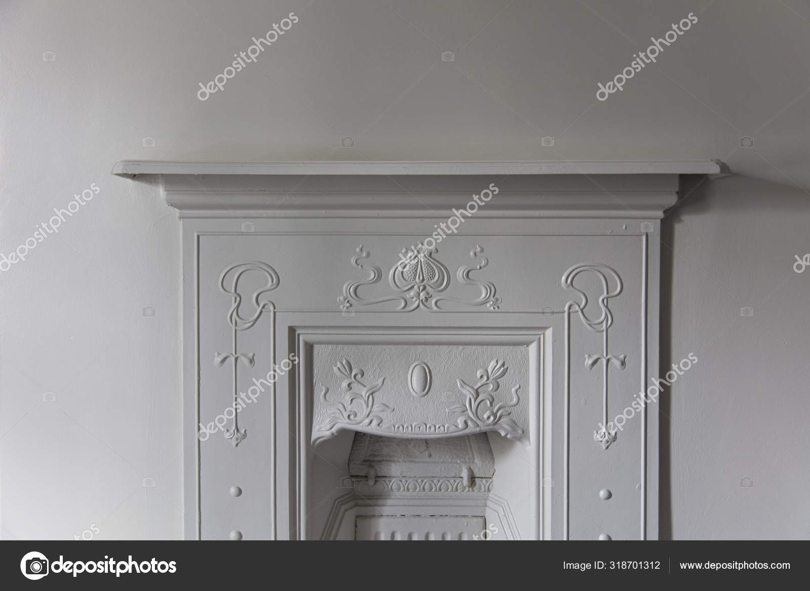 Victoriran Cast Iron Fireplace Surround With White Walls Stock