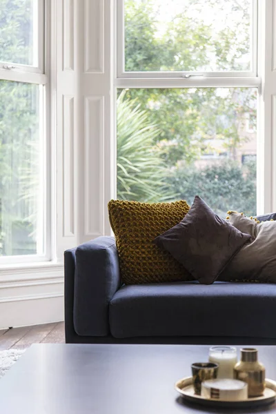 Comfortable blue armchair with cushions in a modern living room interior — Stock Photo, Image