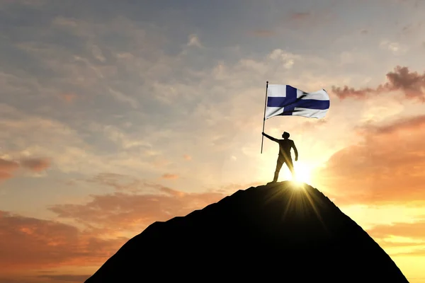 La bandiera finlandese viene sventolata in cima ad una montagna. Rendering 3D — Foto Stock