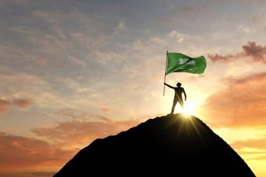 Bir dağ zirvesinde Suudi Arabistan bayrağı sallanıyor. 3d Hazırlama