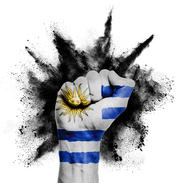 Uruguay raised fist with powder explosion, power, protest concept — Stok fotoğraf