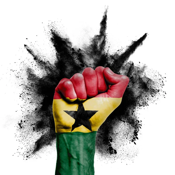 Ghanas erhobene Faust mit Pulverexplosion, Macht, Protestkonzept — Stockfoto