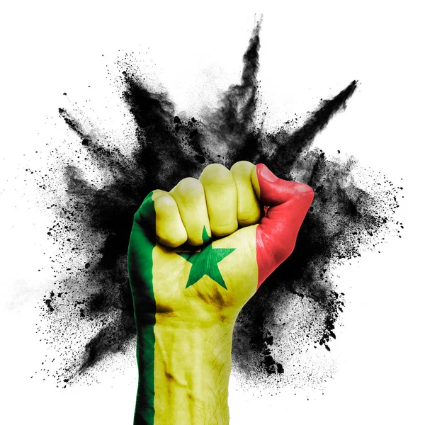 Senegal erhobene Faust mit Pulverexplosion, Macht, Protestkonzept — Stockfoto