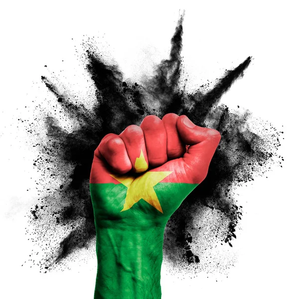 Burkina Faso erhobene Faust mit Pulverexplosion, Macht, Protestkonzept — Stockfoto
