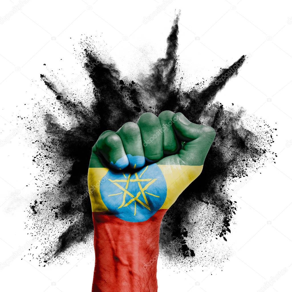 Ethiopia raised fist with powder explosion, power, protest concept