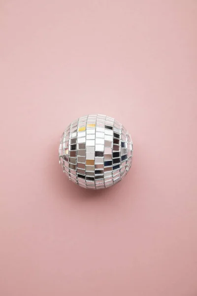 Disco glitter mirror ball on a pastel pink background — Stock Photo, Image