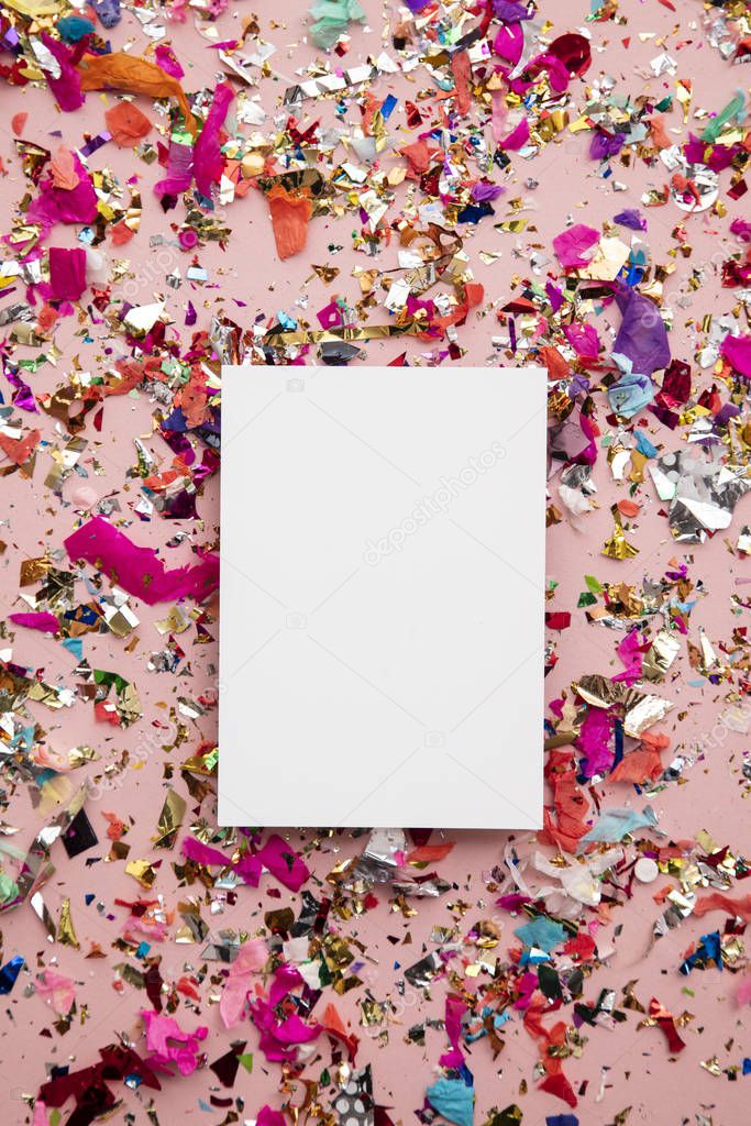Blank card on colourful party sparkling party confetti