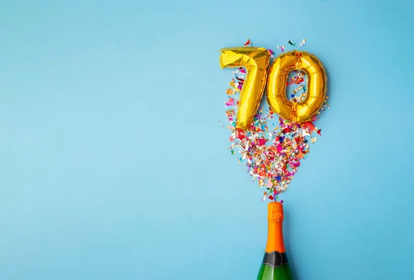 70ste verjaardag champagne fles ballon pop — Stockfoto