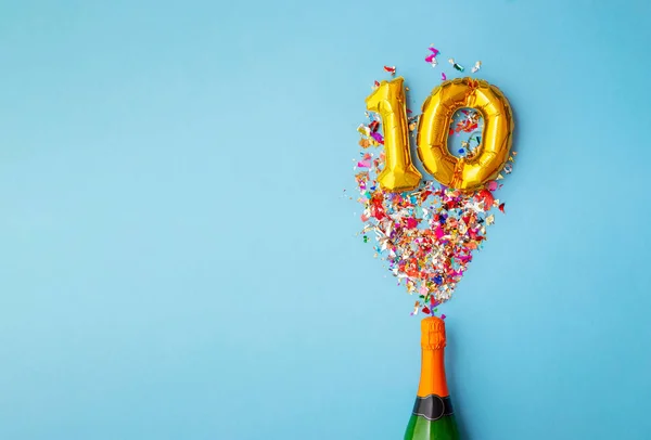 10 aniversario champán botella globo pop — Foto de Stock
