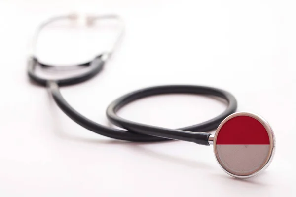Indonesië gezondheidszorg concept. Medische stethoscoop met landvlag — Stockfoto