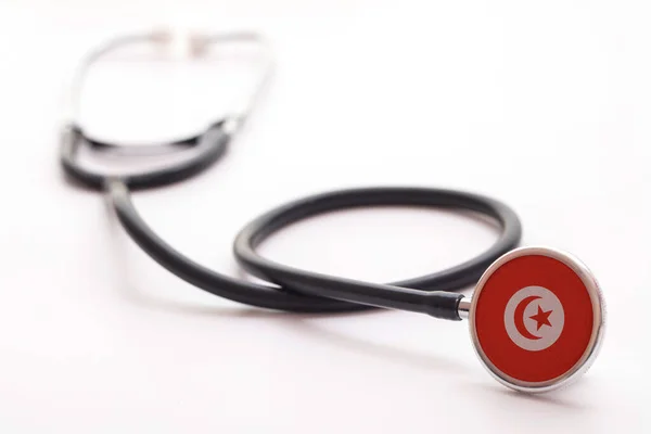 Tunesië gezondheidszorg concept. Medische stethoscoop met landvlag — Stockfoto