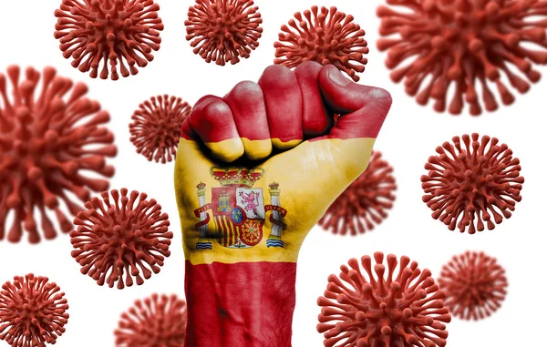 Spain flag fist fighting off coronavius disease — Stock Photo, Image