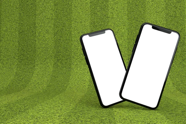 Smartphone med en tom vit skärm på en grön idrottsplats. 3D-återgivning — Stockfoto