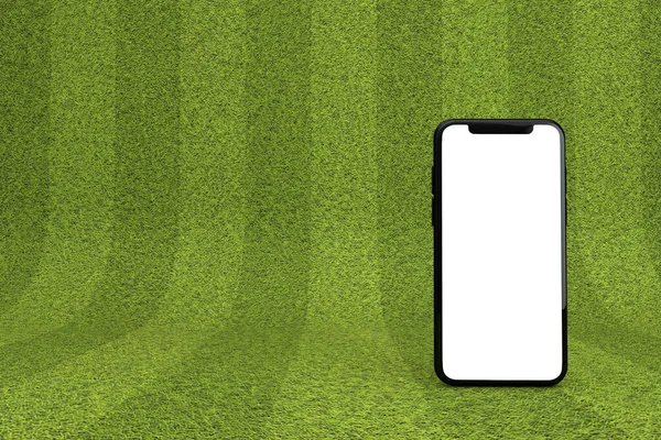 Смартфон с чистым белым экраном на зеленом спортивном поле. 3D рендеринг — стоковое фото