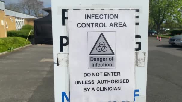 Infection control area warning sign on display during the coronavirus outbreak — Stock Video